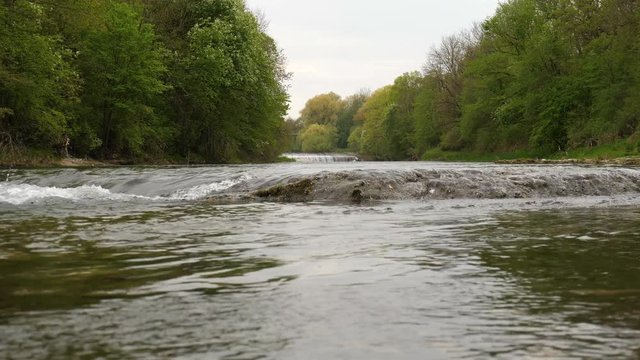 Floating Water of a river in spring in 4K