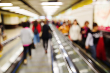 people in an underground station out of focus