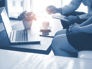 Fototapeta premium A business team office and planning work.Businessman training young woman for the marketing plan.Color effect design.