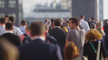LONDON SEPTEMBER 2014 - Crowd of city workers and tourists walking through city - Powered by Adobe