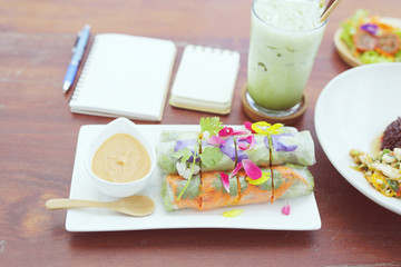 Fototapeta na wymiar Salad roll and green tea