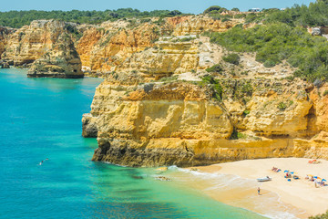 Tourist swimming in atlantic on Algarve coast,Portugal