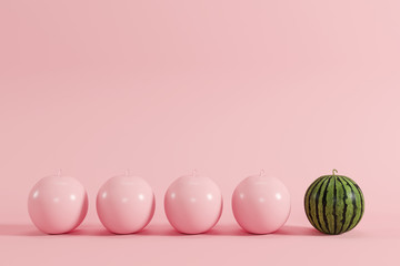 outstanding watermelon on pastel pink background for copyspace. minimal concept.