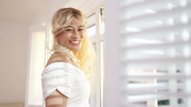 Portrait of smiling transgender man in bridal gown on wedding day