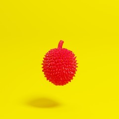 Red  durian  on yellow background for copy space. minimal concept.