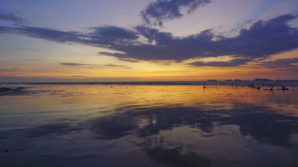 Fototapeta na wymiar Beautiful twilight view at seascape with reflections of sky.