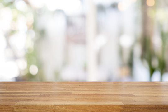 Empty wooden table and blurred white nature background