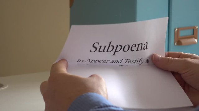 Man receiving subpoena letter