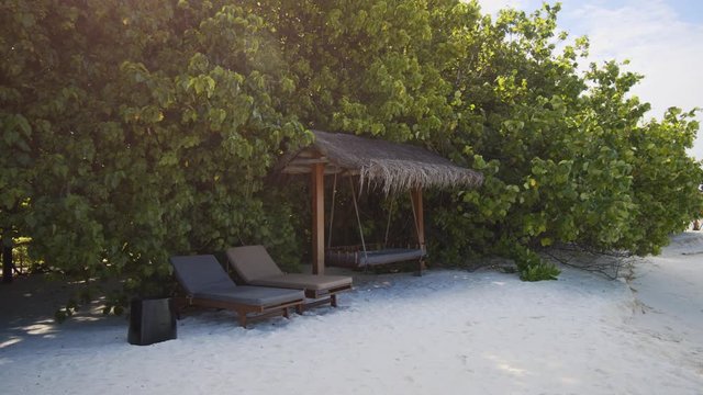 Swing and Loungers in the Shade on a Vaadhoo Island Beach