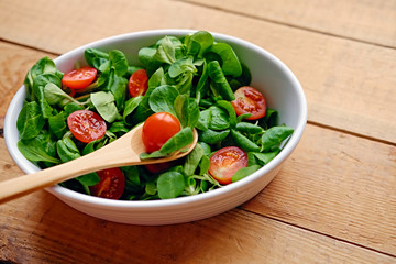 Portion of cherry tomatoes and basil salad.