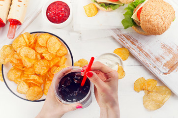 Young Woman hands with Fast food.