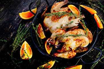 Roasted two chicken with oranges