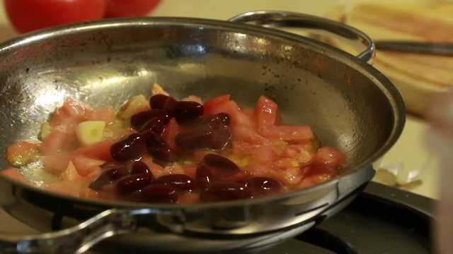 Fried sliced tomato slasa with black beans