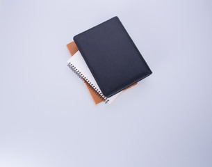 notebook or black leather notebook on the blackground.