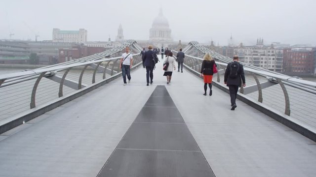 LONDON SEPTEMBER 2014 - Diverse crowd of people crossing Millennium footbridge