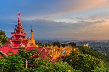 Mandalay Hill is a major pilgrimage site. A panoramic view of Mandalay from the top of Mandalay,...