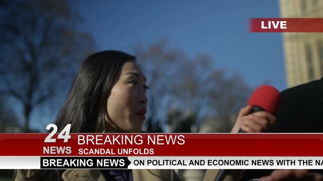  Man in business dress in London being bothered by news reporters