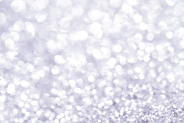 Sillver bokeh texture. Festive glitter background with defocused lights