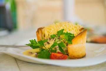 Warm salad with cheese in bread
