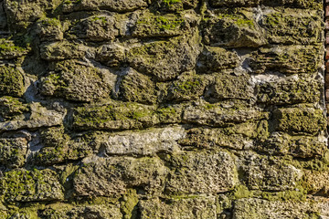 Old stone wall with moss and lichen