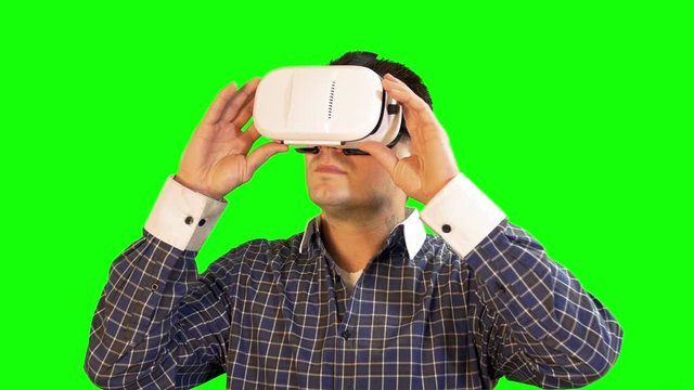 Greenscreen Virtual Reality Man Holding 360 Glasses Slowly Looking Around at Video