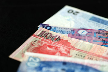 Some banknotes of Hong Kong dollars on a dark background