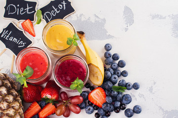 Bright summer smoothies in glass jars