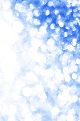 Blue bokeh texture. Festive glitter background with defocused lights