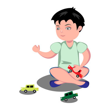 Young boy playing toy cars