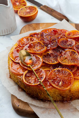 Candied red orange cake on a light background. Selective focus.
