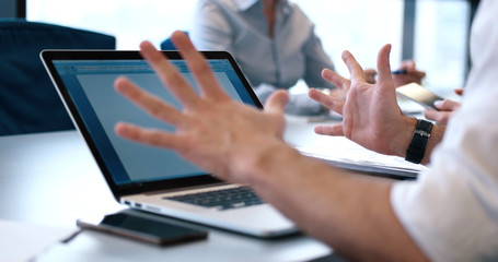 group of business people having a meeting in bright office