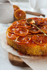 Candied red orange cake on a light background. Selective focus.