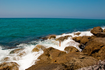 Beautiful seashore with breakwater and large stones