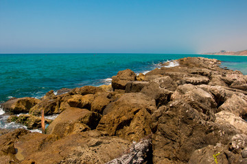 Fototapeta na wymiar Beautiful seashore with breakwater and large stones