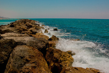 Beautiful seashore with breakwater and large stones