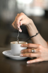 Cup of coffee in the women's hands