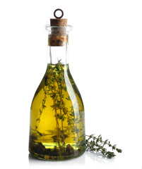 Olive oil with herbs, isolated on white