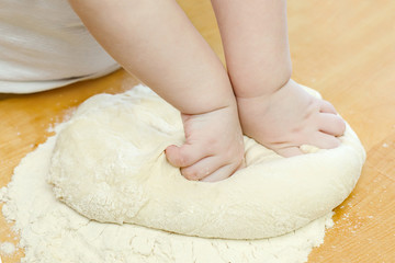 Little Baby`s Hands kneading dough