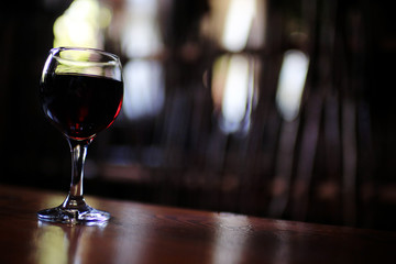 Serving a glass of red wine in a restaurant