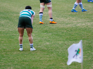 Touch Rugby player taking rest between game
