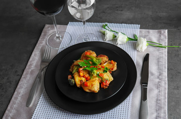 Plate of chicken stir fry with vegetables on table