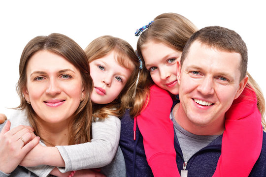 Portrait Of A Happy Family Isolated On White Background