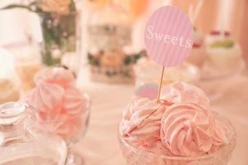 Tasty marshmallows on festive table