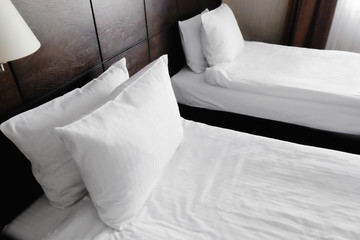 Fototapeta na wymiar Two beds in hotel room