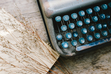 typewriter with grass flower,vintage old fashion style,old tone  color