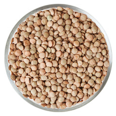 Lentils in glass bowl isolated on white background with clipping path
