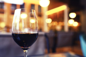 Serving a glass of red wine in a restaurant