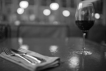 Serving a glass of red wine in a restaurant