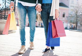 Shopping time. Young couple in shopping. Consumerism, fashion, lifestyle concept