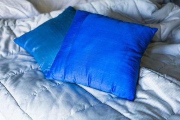 Blue pillows on the bed